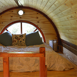 Climb the stairs to the master bedroom. Custom built windows